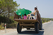 Local people sitting in a tractor, Dipkarpaz, Rizokarpaso, Karpasia, Karpass Peninsula, Cyprus
