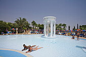 Two women lying in the pool, WaterWorld Waterpark, Agia Napa, South Cyprus, Cyprus