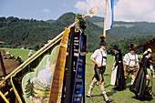 Men and women in traditional dress, regional costume and flag, Upper Bavaria, Bavaria, Germany