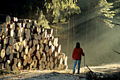 Woman walking in the forest, Bavaria, Germany