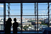 Two people enjoying wiew over the city of Berlin, Germany