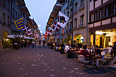 People sitting outside a cafe bar in the Muenstergasse, Old City of Berne, Berne, Switzerland