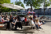 People at a cafe along the banks of the River Rhine, Riviera Klein-Basel, Basel, Switzerland