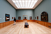 A man looking at paintings in an Art Museum, Kunstmuseum Basel, Holbein, Basel, Switzerland