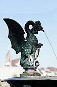 Basels heraldic animal, the Basilisk, featured on a fountain, Basel, Switzerland