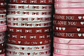 Band for binding cartons or presents delivering a love message for Valentine, Chatuchak Market, Bangkok, Thailand, Southeast Asia