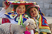 Two children with lamb. Cuzco. Peru