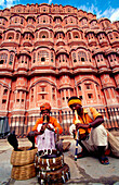 Snake charmers in front of the Hawa Mahal. Jaipur. Rajasthan, India.