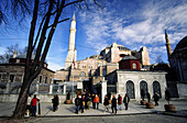 Group of tourists by St. Sophia Mosque (c. 537), Sultanahmet, Istanbul. Turkey