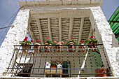 Terrace with bars and flower pots in a typical house in Pampaneira. Alpujarras Mountains area, Granada province. Spain