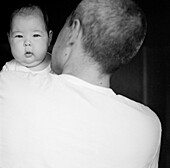  Adult, Adults, B&W, Babies, Baby, Black-and-White, Caucasian, Caucasians, Child, Children, Contemporary, Dad, Facing camera, Families, Family, Father, Fatherhood, Fathers, Hold, Holding, Human, Indoor, Indoors, Infant, Infants, Interior, Looking at camer