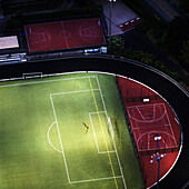 Lone goalkeeper in empty field viewed from the Eiffel Tower. Paris. France