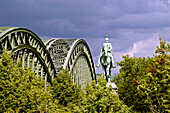 Hohenzollern Bridge and Statue. Cologne. Germany