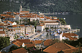 Korcula s old town with more modern roofs in foreground. Korcula Island, Dalmatia. Croatia