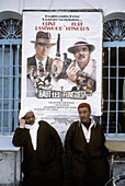 Two men in front of cinema. Houmet es-Souk, Jerba Island. Tunisia