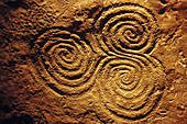 Spiral pattern (c. 3200 b.C.) in Newgrange archeological site. Co. Meath, Ireland