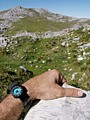 Reading a map. Vega de Ario. Picos de Europa National Park. Biosphere Reserve. Asturias. Spain