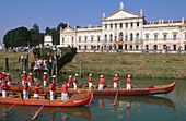 Regata storica traditional boat race in front of Villa Pisani, Brenta river canal bank. Veneto, Italy