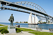 Tall ship Highlander passing under Blue Water International Bridge at Port Huron. Michigan. USA