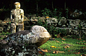 Weather beaten stone statues at the archaeological site Puamau on the island of Hiva Oa, French Polynesia