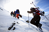 Skier and snowboarders ascending, See, ski region Paznaun, Tyrol, Austria