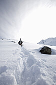 Skiers in deep snow, See, Ski Region Paznaun, Tyrol, Austria