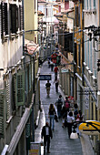 People shopping in an alley in the historic centre of Koper, Slovenia