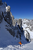 Female backcountry skier ascenting, Griesner Kar, Wilder Kaiser, Kaiser range, Tyrol, Austria