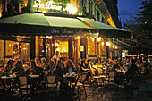 Café in the evening light, Les Deux Magots, waiter serving drinks, Boulevard Saint Germain, 6e Arrondissement Paris, France
