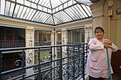 Marie, Concierge, caretaker in the building, a former warehouse now converted into offices, Paris, France