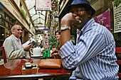 People in a cafe drinking coffee, Passage des Panoramas built in 1799, 2 Arrondissement, Paris, France
