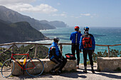 Cyclists Admiring Coastline, Banyalbufar, Mallorca, Balearic Islands, Spain