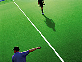 Adult, Adults, Artificial grass, Authority, Color, Colour, Contemporary, Daytime, Exterior, Field, Field hockey, Fields, Game, Games, Green, Half, Halves, Hockey, Horizontal, Human, Leisure, Line, Lines, Male, Man, Match, Matches, Men, Outdoor, Outdoors, 