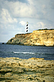 Lighthouse and cliffs. Portinatx, Ibiza. Balearic Islands, Spain