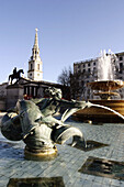 Trafalgar Square fountains and St. Martin-in-the-Fields church (1720, designer James Gibbs) in background. London. England