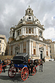 Carriage in front of the church of Santa Maria di Loreto. Rome. Italy