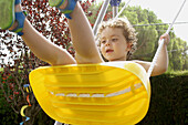 Two year old girl swinging