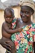 Senoufo young woman with child. Sikasso region, Mali