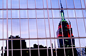 Empire State Building reflecting in Midtown Manhattan. New York City, USA