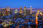 Nighttime view of downtown Montreal skyline and South Shore from atop Mount Royal (Mont Royal) in winter. Quebec, Canada