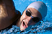 Male swimmer in swimming-pool.
