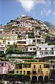 Jumble of houses built into a cliff in Positano, Italy along the Amalfi Coast.