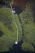 Bridge in lake, boats, aerial view. Småland. Sweden