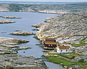 Houses, stone seashore. Ramvikslandet. Bohuslän. Sweden.