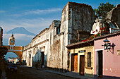 Colonial architecture of Antigua, Guatemala, with Volcano del Agua in the background