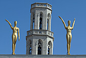 Statues in the exterior of Dalí Museum in Figueres with St. Peters church tower in background. Alt Empordà, Girona province. Catalonia, Spain