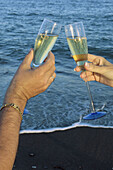 Toasting with champagne on the beach