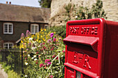 Postbox and cottage in Ludlow, Shropshire, UK