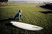 Surfer stretching. Santa Cruz, California. USA