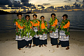 Fijian women performing seasea on the beach at sunset, Nukubati Island Resort, Fiji Islands